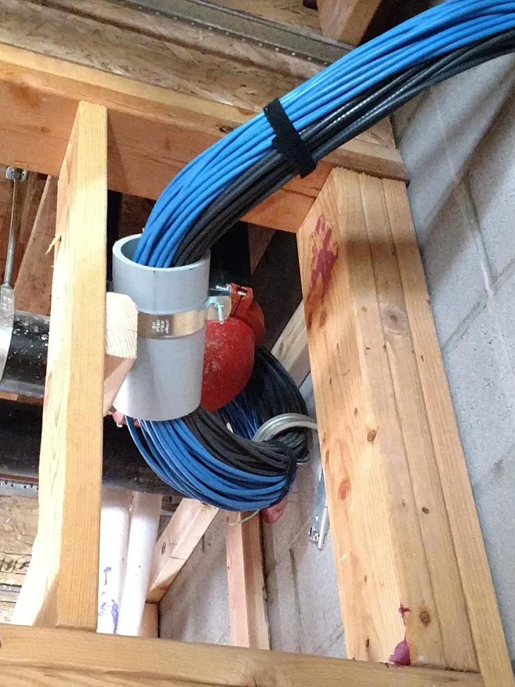 Riser cable run through wall plate boot